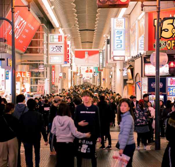 crowd of people walking inside store